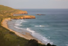 Swell lines evaporate at St Kilda Beach, Dunedin, New Zealand. 