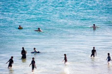 Summer crowds at St Kilda Beach, Dunedin, New Zealand. 