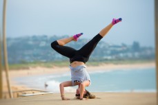 Felicity, of the UK, practising yoga at Dee Why Beach on the Northern beaches of Sydney, NSW, Australia. 