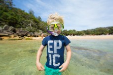 Keo prepares to go snorkelling at Shelley Beach near Manly on the Northern beaches of Sydney, NSW, Australia. 