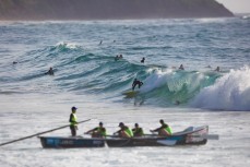 A surfer hooks into a wall at Dee Why Beach on the Northern beaches of Sydney, NSW, Australia. 