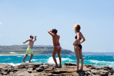 Tourists pose at Palm Beach on the Northern beaches of Sydney, NSW, Australia. 