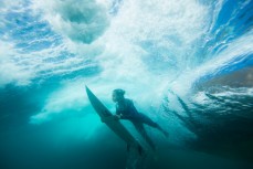 A surfer pushes through a wave in fun conditions at LA  on the Northern beaches of Sydney, NSW, Australia. 