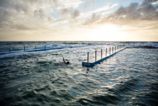 Morning swimmers in the pool at Curl Curl on the Northern beaches of Sydney, NSW, Australia. 