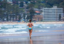 Beach runner at Long Reef on the Northern beaches of Sydney, NSW, Australia. 