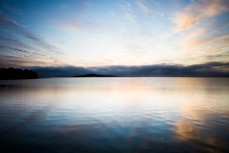 Dawn over Moturata Island at Taieri Mouth, Dunedin, New Zealand. 