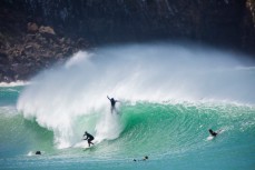 A surfer goes over the falls as Jimi Crooks lines up a barrel at a remote beachbreak in the Catlins, New Zealand. 