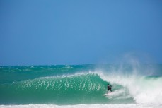 Matt Hewitt, of Mount Maunganui, buries an arm in the wall at a remote beachbreak in the Catlins, New Zealand. 