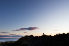 Photographers Alex and Dan capture the rising sun at Aramoana, Dunedin, New Zealand. 