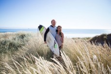 Surfers Zen Wallis and Christina Funck enjoy calm clean conditions at Aramoana, Dunedin, New Zealand. 