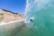 Zen Wallis gets barreled in a clean cyclone swell at Aramoana, Dunedin, New Zealand. 