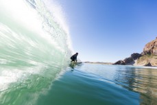 Surfer Christine Funck enjoys calm clean conditions at Aramoana, Dunedin, New Zealand. 