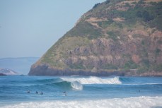 Lazy summer swell at St Kilda Beach, Dunedin, New Zealand. 