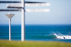 A surfer skips around a section at St Clair Point, Dunedin, New Zealand. 