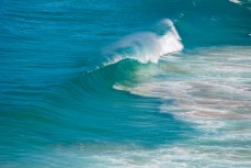 Fun waves at a remote surf break in the Catlins, Southland, New Zealand. 