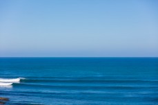 Fun waves at a remote surf break in the Catlins, Southland, New Zealand. 