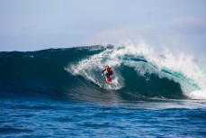 Andy Eman rides a beautiful wave at a remote reefbreak near Dunedin, Otago, New Zealand. 