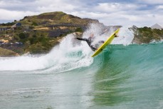 A surfer makes the most of fun waves at Blackhead Beach, Dunedin, New Zealand. 
