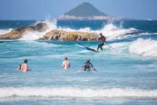 Local artist Steev Peyroux enjoys the summer heat and fun waves at Brighton, Dunedin, New Zealand. 