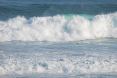 Ché Bliss prepares to duckdive a set wave on a big swell at St Kilda Beach, Dunedin, New Zealand. 