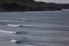 A lineup of fun waves at Back Beach, New Plymouth, Taranaki, New Zealand. 