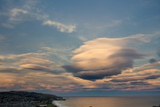 Pre-lenticular clouds over St Clair Beach, Dunedin, New Zealand. 