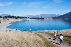 The Morrison family out riding around Lake Hawea, Central Otago, New Zealand. 