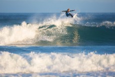 James Murphy revels in fun autumn waves at St Kilda, Dunedin, New Zealand. 