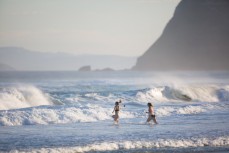 Keen swimmers brave cool autumn conditions at St Kilda, Dunedin, New Zealand. 