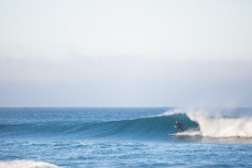 A surfer revels in fun autumn waves at St Kilda, Dunedin, New Zealand. 