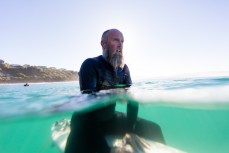 Nick Mills, waits for a set wave at Second Beach, Dunedin, New Zealand. 