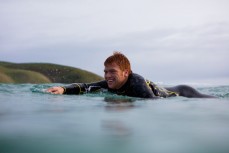 Sam Wallace paddles back out during a solid session in the southern Catlins, New Zealand. 