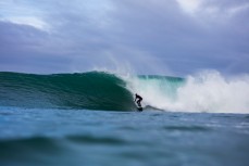 Charlie Cox draws his line as a remote reefbreak unloads deep in the Catlins, New Zealand. 