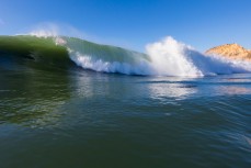 Hamish rides deep in a tube during a fun swell at Karitane Reef, Dunedin, New Zealand. 