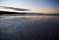 Dawn at a remote beach on Otago Peninsula, Dunedin, New Zealand. 