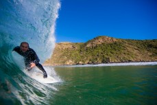 Jack Lewis, of Queenstown, hooks into the barrel in fun waves at a remote beach on Otago Peninsula, Dunedin, New Zealand. 