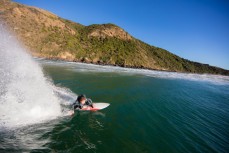 Jordan Kudla, of San Clemente, USA, drives off the bottom in fun waves at a remote beach on Otago Peninsula, Dunedin, New Zealand. 