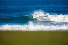 A surfer cracks a turn at St Clair Beach, Dunedin, New Zealand. 