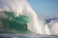 Doug Young takes on a remote reef break on the Otago coast, New Zealand. 