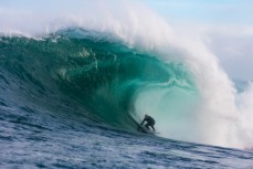 Doug Young draws his line along a warping face at a remote reef break on the Otago coast, New Zealand. 