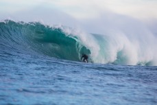 Paul Harrison draws his line along a warping face at a remote reef break on the Otago coast, New Zealand. 