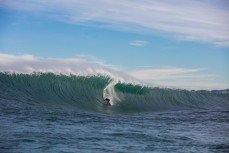 Doug Young draws his line along a warping face at a remote reef break on the Otago coast, New Zealand. 