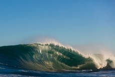 An empty wave breaks at a remote reef break on the Otago coast, New Zealand. 