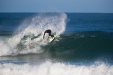 Nat Parsons rides a fun wave at Blackhead Beach, Dunedin, New Zealand. 