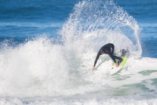 Nat Parsons rides a fun wave at Blackhead Beach, Dunedin, New Zealand. 