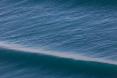 Warping swell lines on a fun day up the North Coast, Dunedin, New Zealand. 