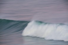 A speed blur wave breaks at St Clair Point, Dunedin, New Zealand. 