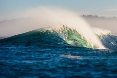 A wave unloads at a remote reef break on the Otago coast, New Zealand. 
