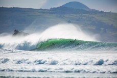 Surfers revel in fun conditions at Aramoana, Dunedin, New Zealand. 