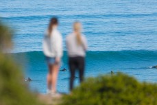 Spring waves as onlookers take it all in at Blackhead Beach, Dunedin, New Zealand. 